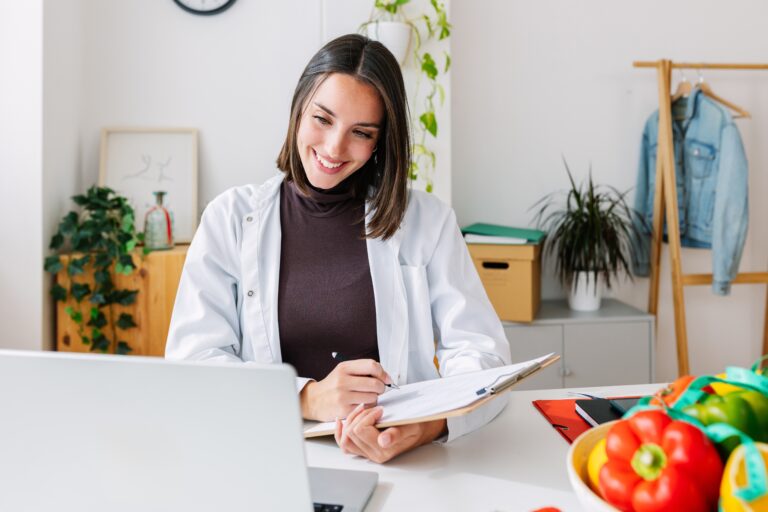 Young,Female,Nutritionist,Talking,With,Patient,Through,Laptop,Computer,Video